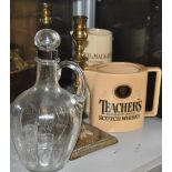 An early 20th Century silver mounted whisky decanter together with two water jugs and a pair of