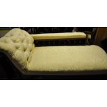 Late Victorian mahogany chaise longe upholstered in buttoned patterned gold fabric