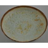 A Hutian kiln style, celadon dish, impressed with trailing flowers, D. 17cm.