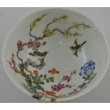 A Chinese Famille rose bowl, depicting birds amongst trees,