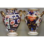 A near pair of Nineteenth Century Derby porcelain Imari palette baluster vases, H:9.