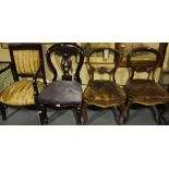 Three Victorian mahogany balloon back dining chairs together with an Empire style elbow chair and