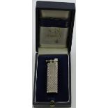 A silver Dunhill lighter, the body decorated with a basket-weave pattern,