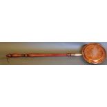 A 19th century copper warming pan, with a turned hardwood handle, L. 112cm.