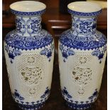 A pair of Chinese blue and white vases with pierced bodies, H.