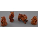 Four hardwood netsuke carvings modelled as hares