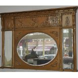 A Victorian giltwood and gesso overmantle mirror with molded classical frieze over triple bevelled