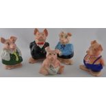 A set of 5 Nat West pottery piggy banks