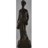 A bronzed plaster figure of a Grecian maiden