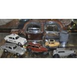 Two early Dinky die cast cars, two later cars,