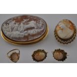 A late Victorian oval carved cameo brooch finely decorated with a classical chariot scene in 18ct