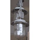 A pair of East European industrial style ceiling lights with circular aluminium shades,