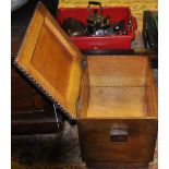 An oak coal scuttle, rectangular with a brown upholstered seat, W. 39cm.