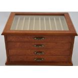 A pen collector's four drawer bur wood display box