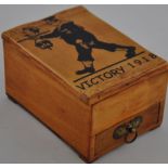 An unusual small wooden desk cabinet of First World War interest decorated with a British sailor