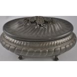 A large pewter tureen with foliate knop.