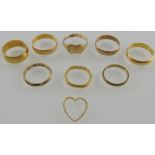 Four 22ct yellow gold wedding bands together with three further yellow gold bands and a signet ring,