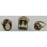 Three 9ct yellow gold dress ring set smokey quartz and garnet