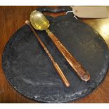 An early 20th Century cast iron griddle plate together with a Victorian cast copper handle and a