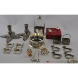 A quantity of silver plated items comprising a pair of thistle form candlesticks,