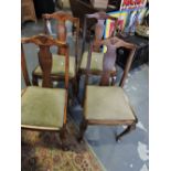 A set of four 20th century stained beech dining chairs,