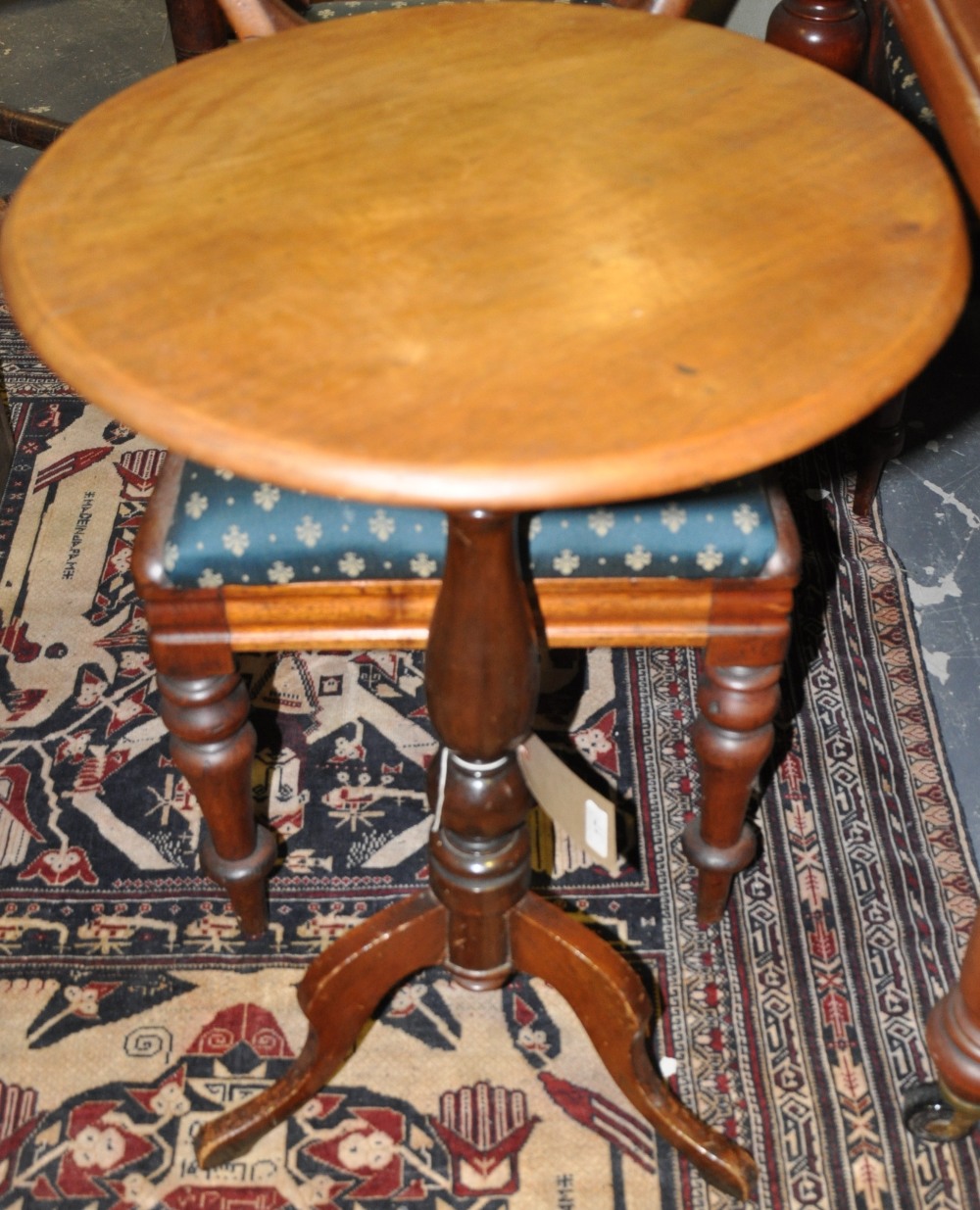 A Victorian mahogany circular wine table on turned pillar and cabriole tripod