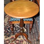 A Victorian mahogany circular wine table on turned pillar and cabriole tripod