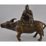 A Chinese bronze figure of Laozi on water buffalo, H22cm.