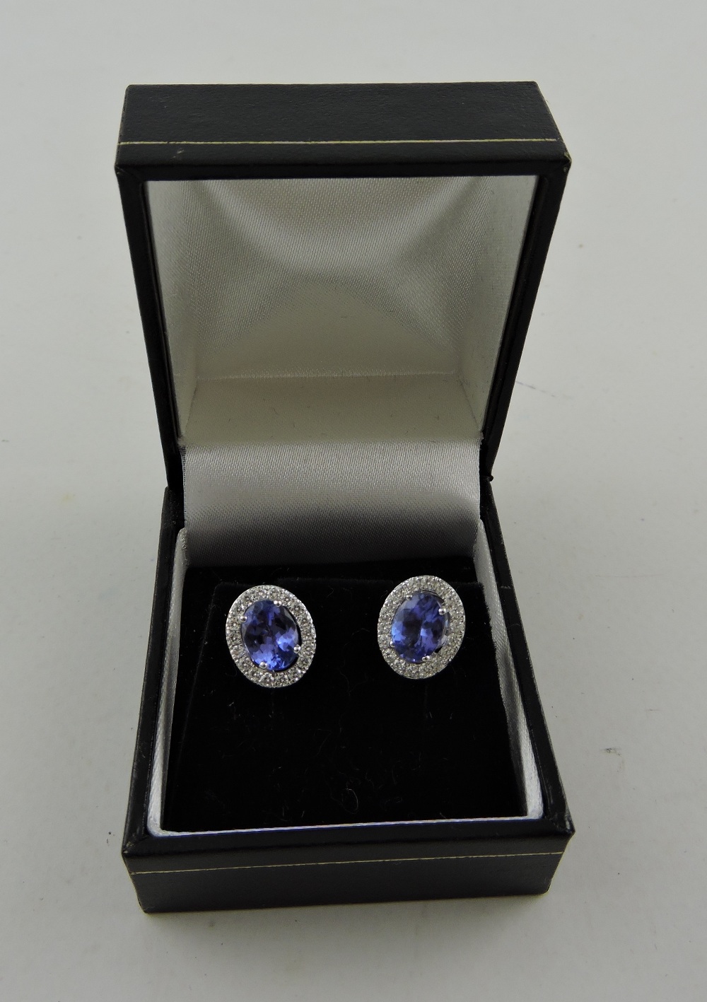 A pair of tanzanite and diamond ear studs, the central stone approx. 2. - Image 2 of 2