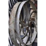 A pair of Victorian cast iron 6 spoke cart wheel,