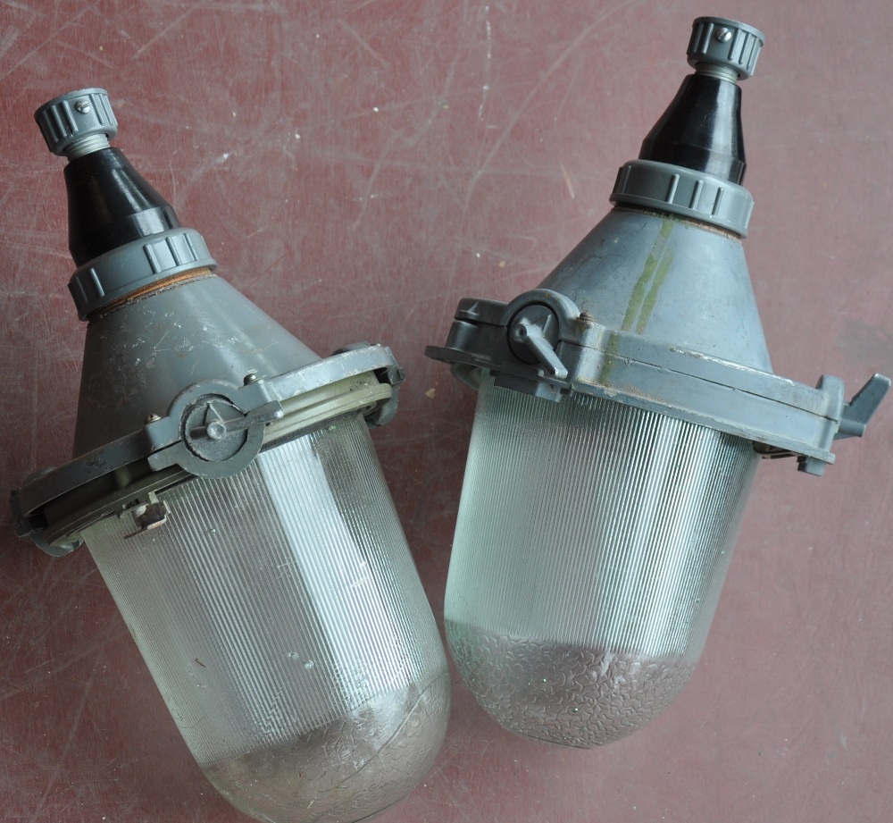 A pair of East European industrial ceiling lights with ribbed moulded shades