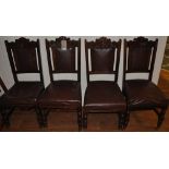 A set of four late Victorian carved walnut dining chairs