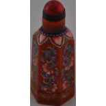 A Peking glass snuff bottle on orange ground with red stopper,