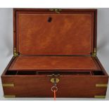 A mid 19th century mahogany writing slope, rectangular with brass binding and a peripheral drawer,