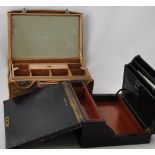 A Victorian black leather covered writing slope with mahogany interior together with a later