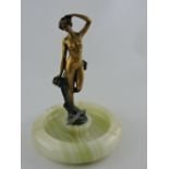 A bronze Art Nouveau style figure, nude standing with a bird at her feet,