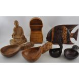 A quantity of treen items including a ladle with a bird handle,