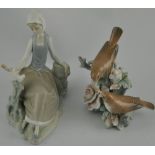 A Lladro figure of a young woman with a bird on a branch, H.