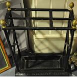 A late Victorian black painted cast iron six division stick stand