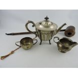 A silver-plated teapot, of fluted form and raised on pad feet,