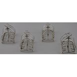 A set of 4 Edwardian toast racks,