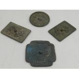 A collection of four Chinese bronze wall mirrors