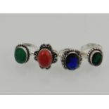 Four white metal and gem stone set dress rings.