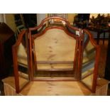 An early 20th century mahogany tryptic table mirror.