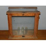 An oak display case, with glass panels. H: 43cm W: 27cm L: 45.5cm