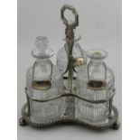 A late 19th / early 20th century silver plated decanter stand, with three glass decanters.