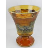 An early 20th century orange ground glass urn, having gilt edge, the centre etched with horse and