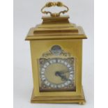 A brass cased mantle clock by Mappin & Webb, the silvered dial set out in Roman numerals, H. 15cm