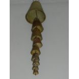 A brass wind chime made out of bells. L.55cm