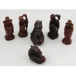 A collection of Chinese resin figurines of gods and dragons.